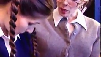 Two Women Explore Their Sexuality In A Classroom Setting